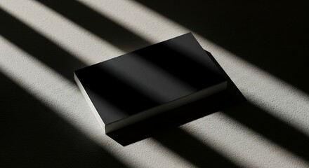 Black business card on textured surface