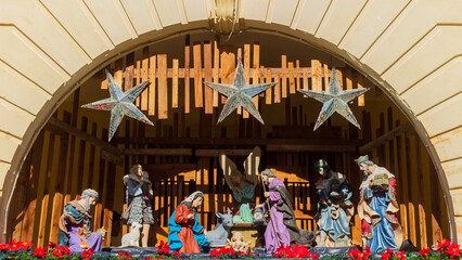 Nativity Scene In A Wooden Stable With Stars And Figures Of Mary, Joseph, And The Nativity Baby Jesus