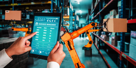 Smart robot arm systems for innovative warehouse and factory digital technology . Automation manufacturing robot controlled by industry engineering using IOT software connected to internet network .
