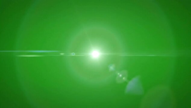 Bright lens flare effect on a vibrant green screen background, perfect for compositing.