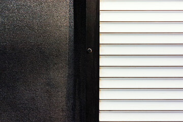 Black wall and white decorative door.