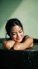 Woman seated in cold water for therapy. Healing, refreshment and calm.
