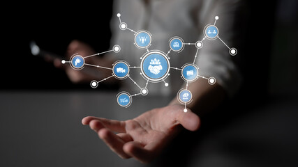This image depicts a hand reaching out with floating icons symbolizing digital connections, representing technology, networking, and modern communication strategies. Tessel