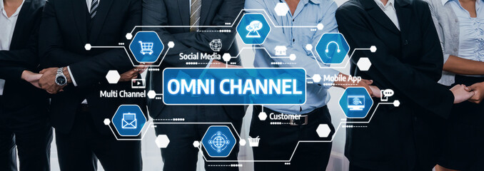 A professional business team engages in a dynamic discussion about omni channel marketing, surrounded by digital icons representing modern technology and strategies. Amity