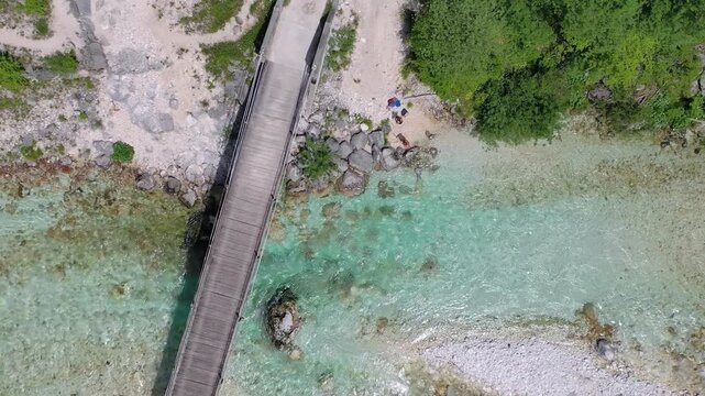 Top-down aerial view of clear alpine river and stones, Slovenia