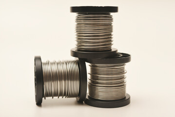 Coils with solder. Plastic coils with tin-lead solder. Materials for electronics repair.