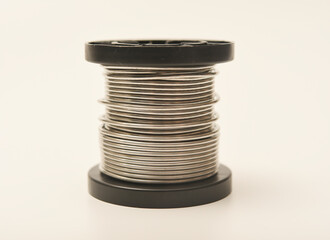 Coils with solder. Plastic coils with tin-lead solder. Materials for electronics repair.