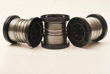 Coils with solder. Plastic coils with tin-lead solder. Materials for electronics repair.