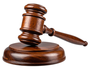 Close-up of a wooden gavel resting on its stand against a solid black backdrop