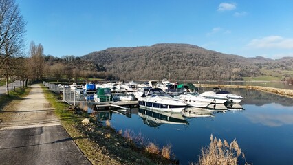 Aerial view of the port and boats on the Lac du Lit au Roi, taken by drone, Massignieu de Rives, France