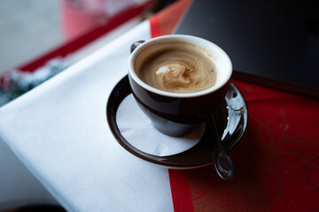 cup of coffee on wooden table