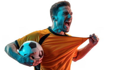 Passionate male soccer player screaming in triumph while holding a football