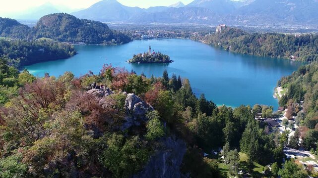 Aerial panorama of Lake Bled with island and autumn foliage, Slovenia