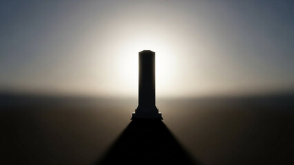 Minimal memorial pillar silhouette with gentle backlight.