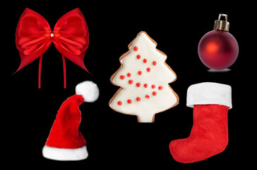 New Year's toys, red bow and Santa Claus hat on a black background.