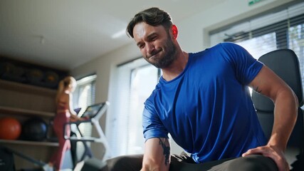 Strong athlete lifting weight practicing strength exercises in gym closeup. 