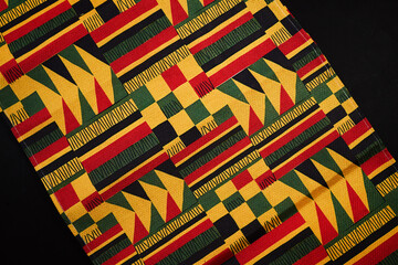 Kente cloth fabric displaying a vibrant ghana ethnic pattern
