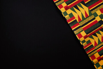 Ghanaian kente cloth with traditional african pattern and copy space
