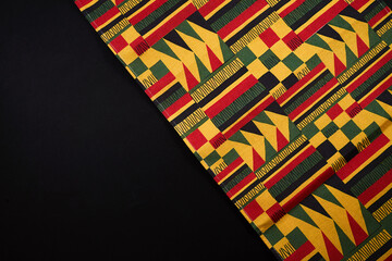 Ghanaian kente cloth with traditional african pattern and copy space