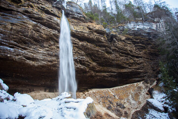 Pericnik waterfall in Vrata valley in Slovenia, winter landscape