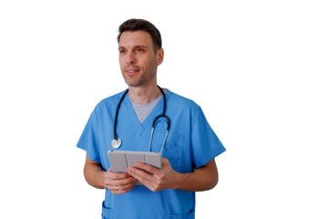 Male doctor wearing blue scrubs and stethoscope, examining patient data on a digital tablet, healthcare technology