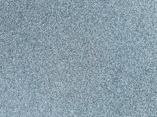 Fototapeta premium Close up top view of natural ice surface covered with fine white snow crystals creating a beautiful winter texture background