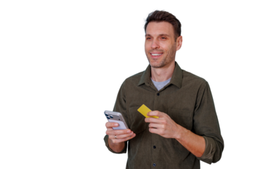 Man smiling, making an online purchase, entering credit card details on a smartphone, enjoying convenient mobile banking and e-commerce