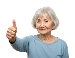 Elderly Asian woman with grey hair smiles happily while giving a confident thumbs up gesture, expressing approval and satisfaction with a positive attitude.