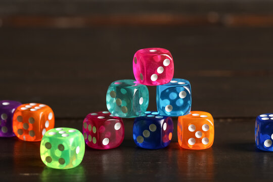 Colorful game dices on wooden background