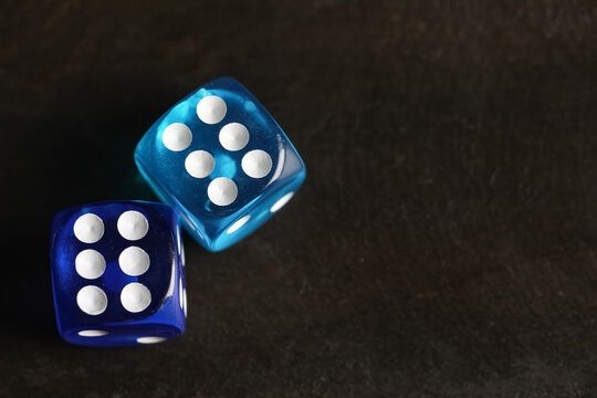 Blue game dices on wooden background