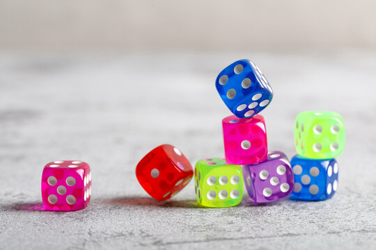 Colorful game dices on grey background