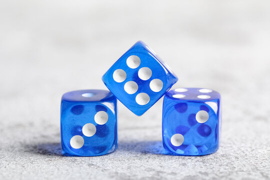 Blue game dices on grey background