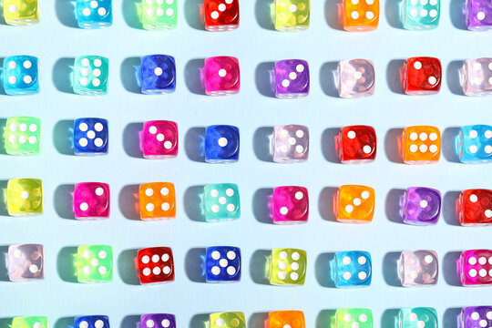 Colorful game dices on blue background