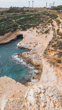Cliffside aerial view of Malta's scenic Xatt l-Ahmar beach.