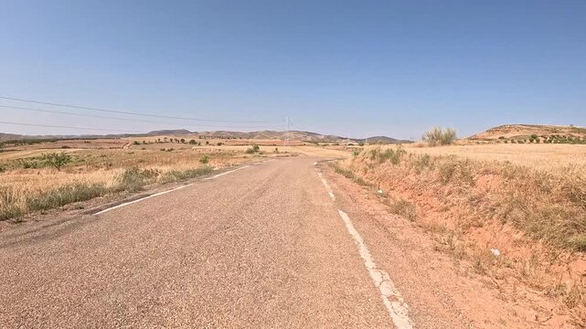 A-2504 paved road through agricultural fields between Cervera de la Canada and Villalengua, province of Zaragoza, Aragon, Spain