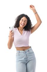 Happy young African-American woman with modern mobile phone dancing on white background
