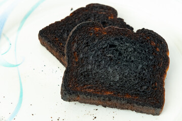 Isolated slice of burnt toast closeup