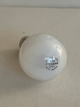 Seattle WA - December 26 2025 - A white glass light bulb 