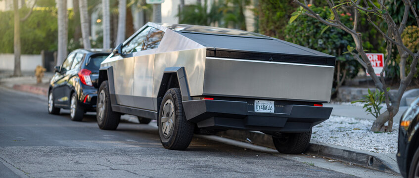 LOS ANGELES - May 2, 2025: Tesla Cybertruck electric pickup truck parked on a residential city street. Back view.