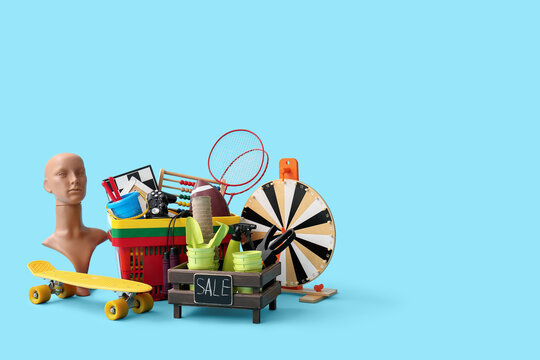 Unwanted stuff for garage sale on blue background