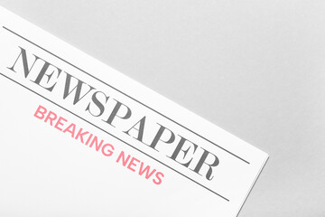 Blank newspaper on grey background