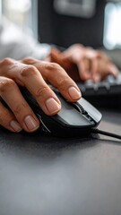 Fototapeta premium Close up of Person Typing on Keyboard and Using Computer Mouse in Office Environment with Soft Lighting