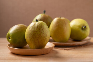 Fresh pear on wooden background