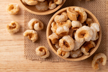 Pork rind in a wooden bowl, Northern Thai food, Table top view