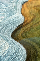 background with curves and lines in stone of famous verzasca river, lavertezzo, switzerland