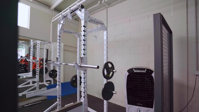 Modern squat rack inside gym training area