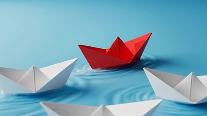 Red Paper Boat Leads White Boats on Blue Water.
