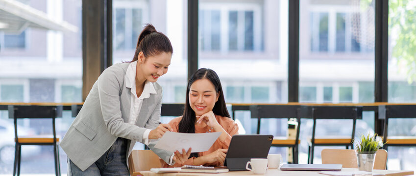 Business women and graphs on tablet screen for finance results, profit growth and budget review. Staff, team and digital with financial report, revenue stats and dividend comparison of risk assessment - Powered by Adobe