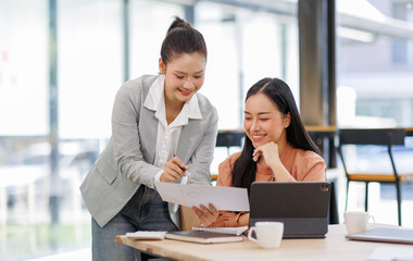 Business women and graphs on tablet screen for finance results, profit growth and budget review. Staff, team and digital with financial report, revenue stats and dividend comparison of risk assessment