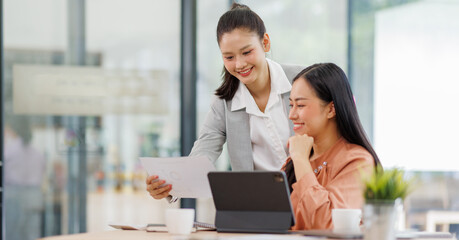 Business women and graphs on tablet screen for finance results, profit growth and budget review. Staff, team and digital with financial report, revenue stats and dividend comparison of risk assessment